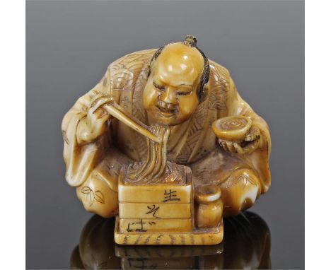 Japanese Meiji period ivory netsuke, carved as a figure eating noodles, signed to the base, 3.7cm high