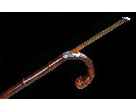 Horse measuring stick of bamboo with crook handle white metal mount with patent stamp, of usual form. Length 91cm
