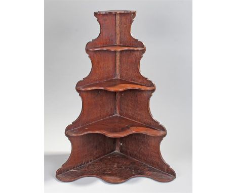 Victorian oak corner shelf, the tiered shelf with undulating waterfall tiers, 79cm high