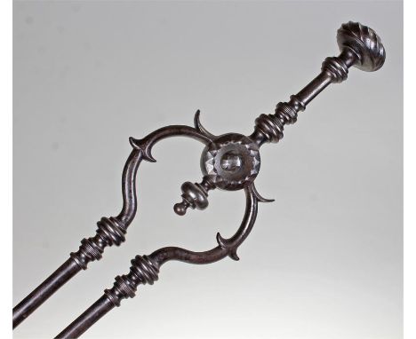 Pair of George III steel fire tongs, the swirl finial above a turned handle and a pair of turned tong arms, 74cm high, togeth