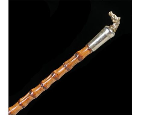 Cane stick with horse head handle with E L Lined stamp to the collar and with brass ferrule. Length 72.5cm