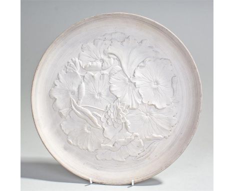 Christopher Dresser for Linthorpe pottery charger, decorated with prunus blossoms, impressed marks to the reverse, HT monogra