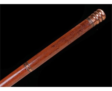 Tipple stick with copper coloured top which unscrews to reveal a glass goblet, the shaft unscrews to reveal the glass vial. W