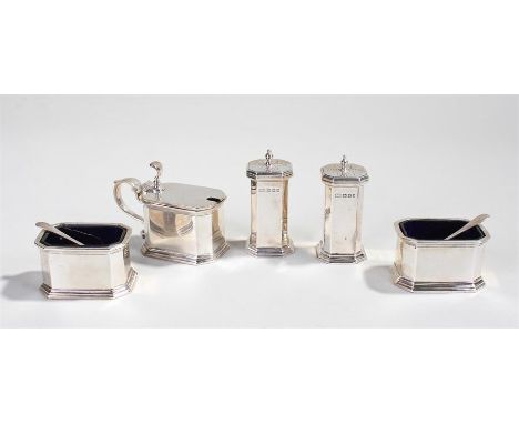 George V silver cruet set, London 1921, maker T R, consisting of two peppers, two salts with blue glass liners and a mustard 