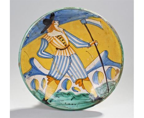 Early 17th Century Montelupo pottery dish, decorated in typical colours with a soldier carrying an axe. 32cm diameter
