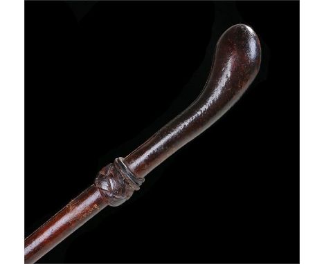 Victorian walking stick the shaft and handle covers in leather, the collage with a leather knot and metal ferrule. Length 85.