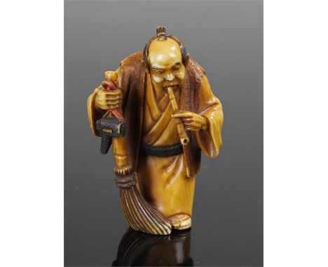 Japanese Meiji period ivory netsuke, carved as a man smoking from a pipe and a broom in his hand, 4.2cm high