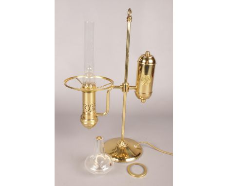 A unusual brass and glass electric table lamp.  