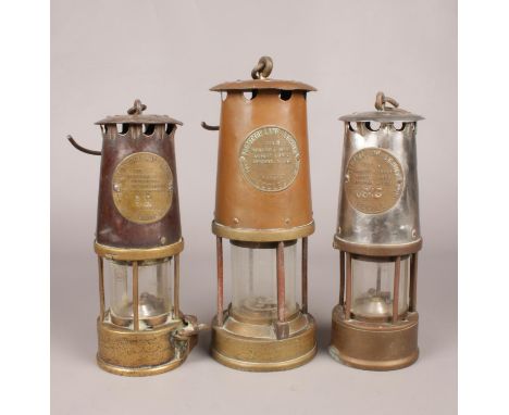 Three miners lamps - all made by The Protectors Lamp &amp; Lighting Co Ltd.  Two Type SL &amp; 6. Two Eccles &amp; one Eccles