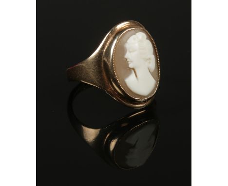 A 9ct gold cameo ring, portrait of a maiden. Size N 1/2. (4.31g).  