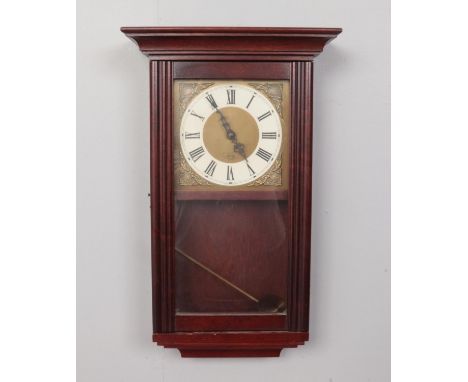 An Acctim Mahogany cased wall clock with pendulum. H: 54cm, W: 33cm.  Condition good.