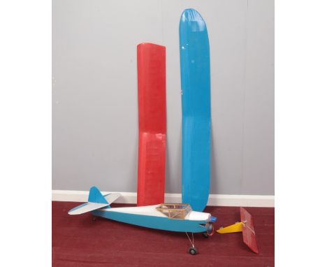 A light model airplane. Comprising of a single propeller /engine to the nose, two front wheels and one rear landing wheel and