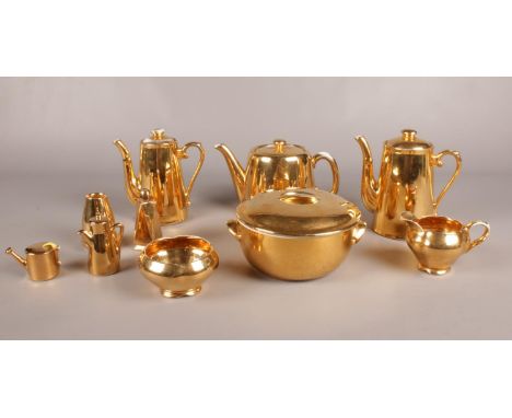 A group of Royal Worcester Gold Lustre oven to table ware. Teapot, coffee pot etc to include Royal Winton examples.  