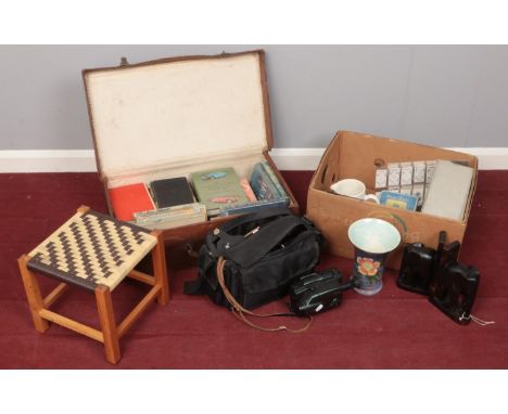 A quantity of miscellaneous. Including bookends, books, camcorder, projector slides, etc.  