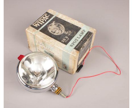 A boxed Wipac spot lamp.  Broken glass within lamp.