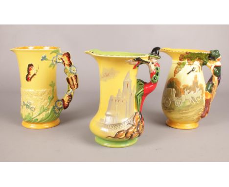 Three Burleigh Ware 1930's hand painted jugs. ' Pied Piper' (Limited edition 41), 'Highway man' 'Butterflies'. 20 cm height. 