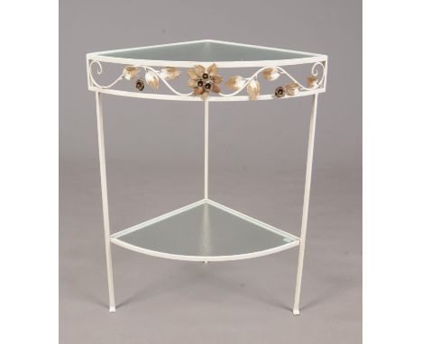 A painted wrought iron corner glass topped table. Comprising of a lower shelf with floral decoration. H: 75.5cm, W: 43cm.  Co