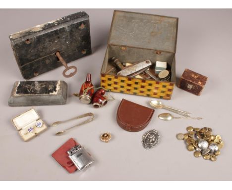 A group of collectables. Rolstar lighter, sugar tongs, vintage leather coin wallet, Pioneer clock pins, assortment of buttons