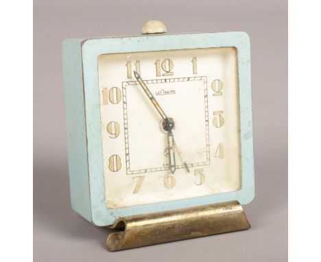 A small metal Le Coultre alarm clock.  