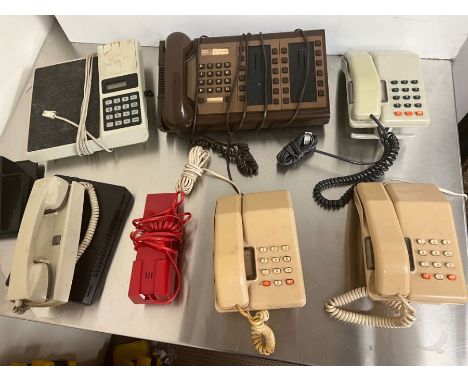 Five press button phones, one intercom and others 