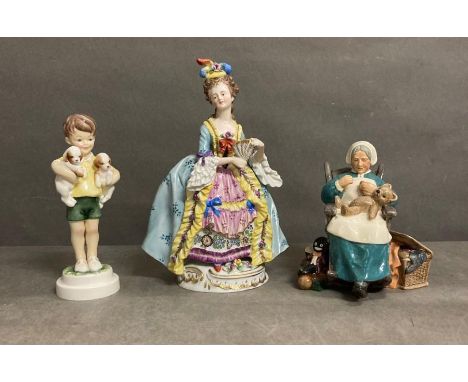 Three porcelain figures to include Royal Worcester "Boy with poppies" Royal Doulton "Nanny" and lady with a fan 