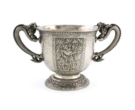 A Chinese silver two-handled cup, the underside of the base with Chinese characters, circular form, dragon scroll handles, th