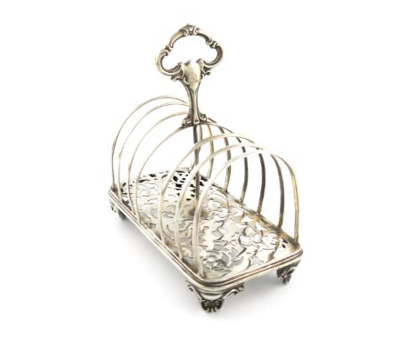 A Victorian seven-bar toast rack, by Henry Wilkinson and Co, Sheffield 1850, rectangular form, central scroll carrying handle