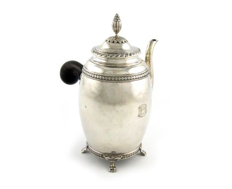 A Swedish silver coffee pot, by C.F. Carlman, Stockholm, 1916, ovoid form body, with a wooden side handle, husk borders, the 