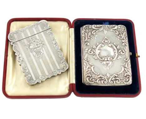 An Edwardian silver card case, by Deakin and Francis, Birmingham 1905, rectangular form, embossed foliate scroll decoration, 