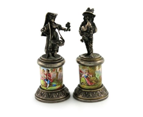 A pair of Austro-Hungarian silver-gilt and silver-mounted enamel figures, maker's mark of LP, modelled as a flower seller and