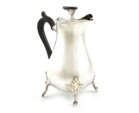 A Dutch silver hot milk pot, maker's mark worn, Amsterdam, possibly 1786, with a 19th century tax mark, baluster form, scroll