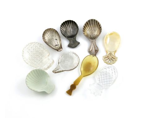 A collection of nine caddy spoons, comprising: a Wedgwood dry bodied stoneware caddy spoon, of shell form, three cut glass ca
