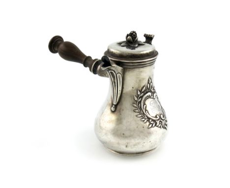 A 19th century French silver milk pot, baluster form, turned wooden side handle, the hinged cover with a cone finial, on a ci