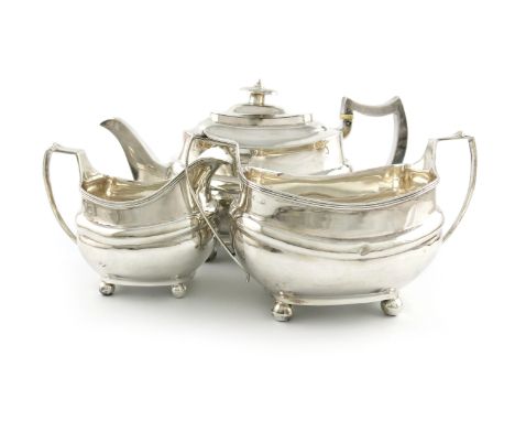 λA three-piece George III silver tea set, maker's mark partially worn, ?R, London 1816, rounded rectangular bellied form, scr