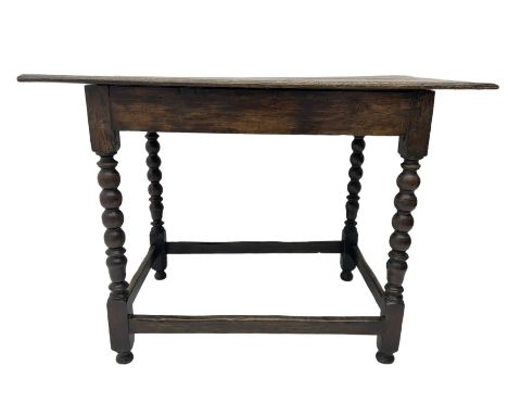 18th century oak table, rectangular breadboarded top, on bobbin turned supports joined by plain stretchersDimensions: Height: