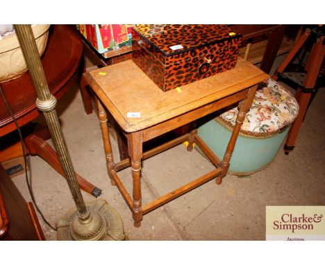 A light oak occasional table 