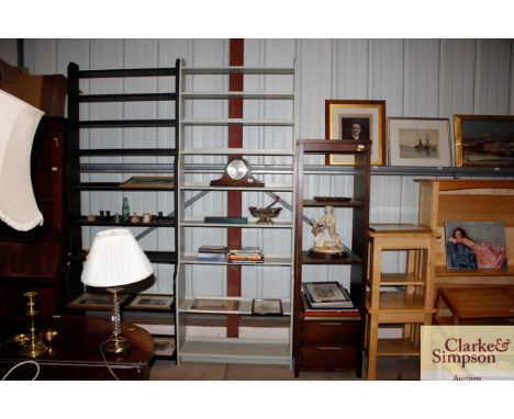 A light green painted graduated bookcase