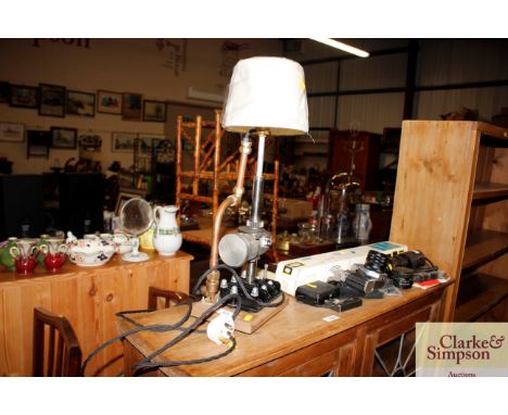 A novelty industrial style table lamp made from engine parts 