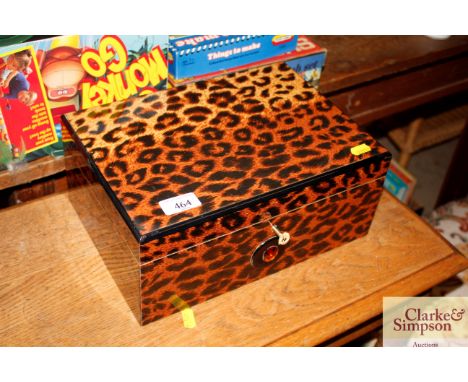 A jewellery box decorated faux leopard skin print