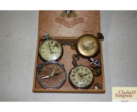 Three various pocket watches; a compass style watch; keys; badges etc.