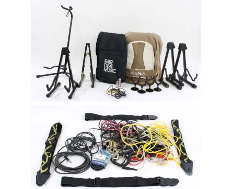 Selection of guitar spares and accessories to include five guitar stands, four guitar wall hangers, a Shadow acoustic guitar 