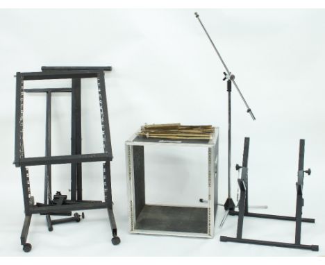 Selection of useful studio stands to include an open flight case suitable for twelve units, two keyboard stands (one with ris