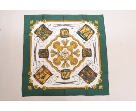 A  HERMES SCARF - 1980'S LES TAMBOURS Silk twill - designed by Joachim Metz in 1980 - Hermes - Paris. 90cms x 90cms. unworn c
