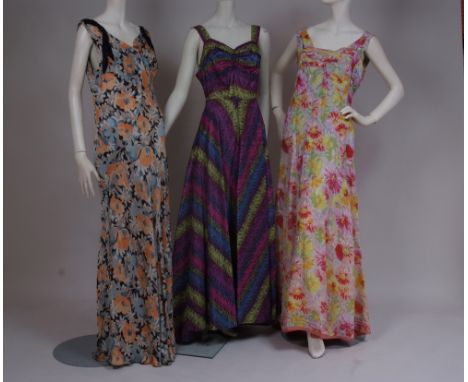 THREE 1930/40'S EVENING DRESSES - SIZE 12  An early 1940's satin evening gown, structured from panels of peach, black and blu