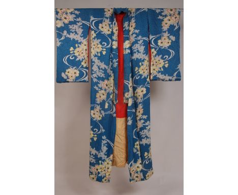 TWO C19TH SILK KIMONOS Mid blue silk damask with floral motifs, red silk lining, no sash. 60" Long. A further green silk with