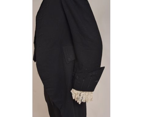 CIRCA 1900 JUDGES FROCK COAT, WAISTCOAT AND BREECHES. A frock coat, waistcoat and breeches made from wool and worn by a Judge