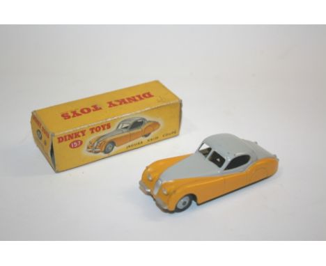DINKY TOY - JAGUAR a boxed Jaguar XK120 two tone issue, with a yellow lower body and light grey upper body. 