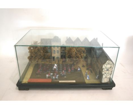 MILITARY DIORAMA - WILLIAM CARMAN a Military Diorama in a glass case,  with a label which reads First Foot Guards on Tower Gr