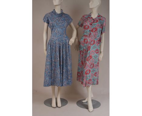 TWO 1940'S SUMMER COTTON PRINT DAY DRESSES A fabulous blue, white and grey cotton paisley print dress from the 1940's. With a