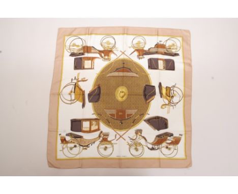 A HERMES SCARF - LES VOITURES A TRANSFORMATION Silk twill - Designed by Francoise de la Perriere. 90cms x 90cms. Unworn condi